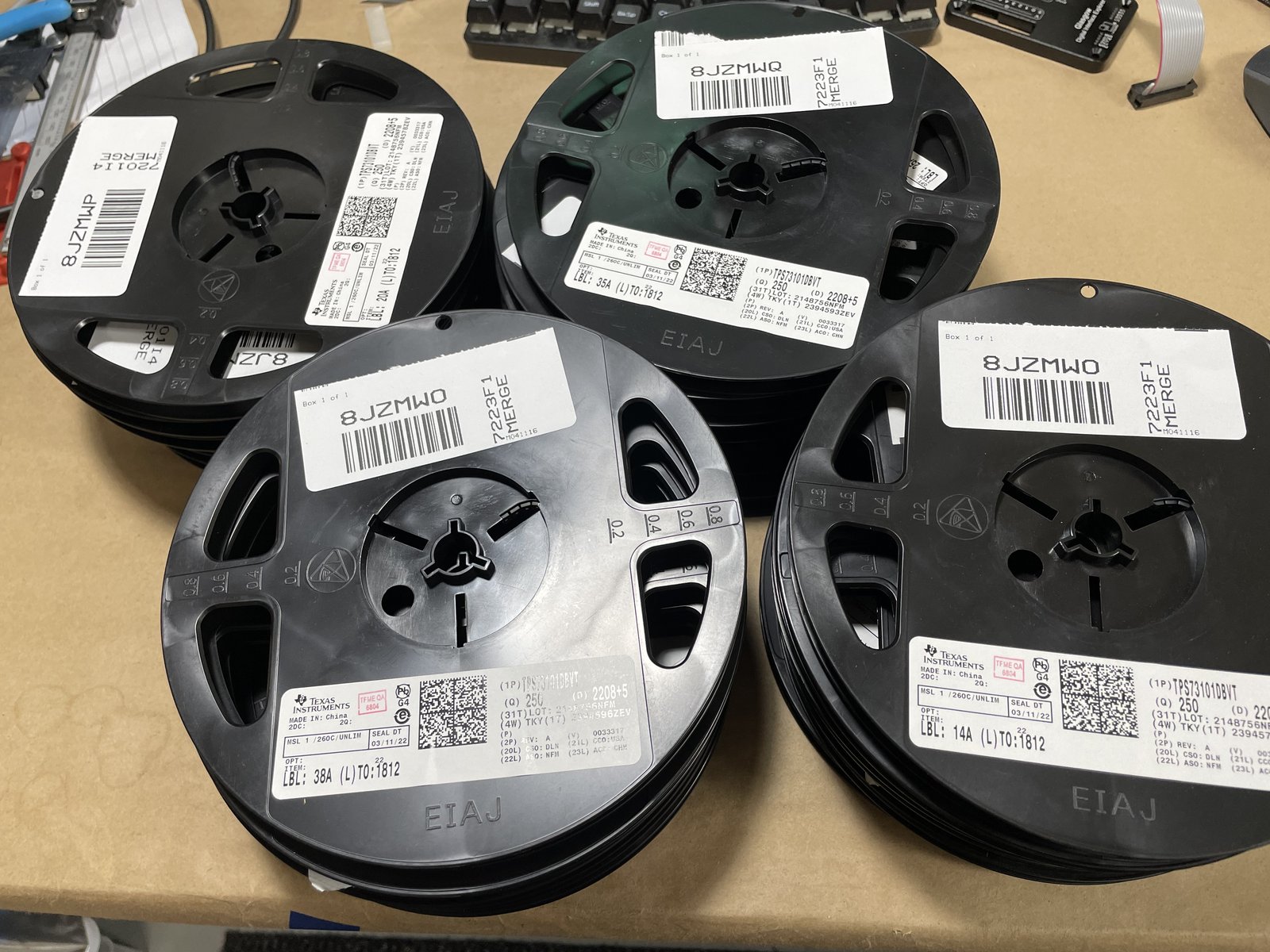 Several piles of 250 piece count reels