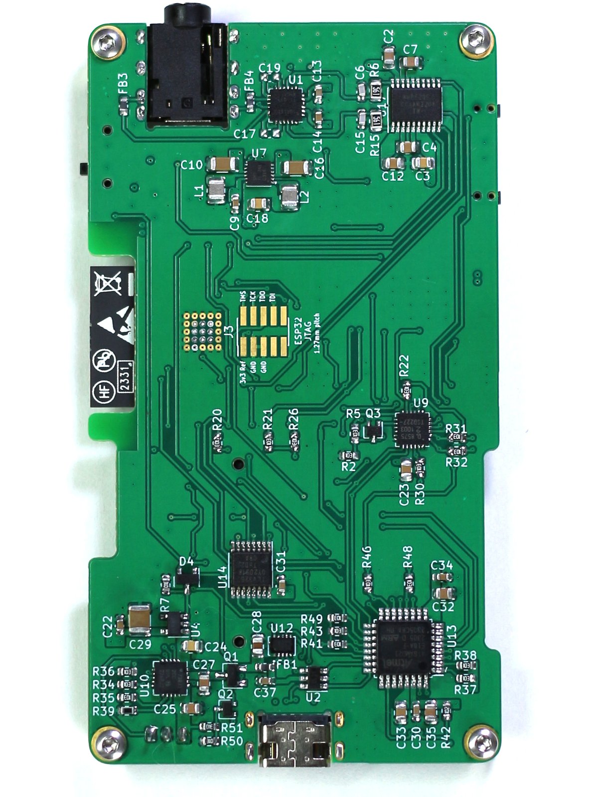 The reverse side of the same rectangular portrait-orientation PCB. It contains a large variety of small components.