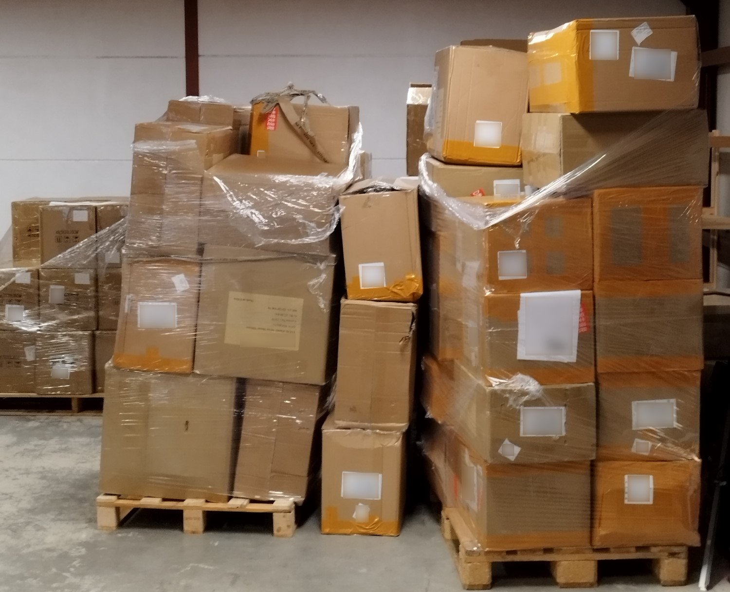 Pallets of straps with pallets of cases in the background. We're running out of space in the Cave...