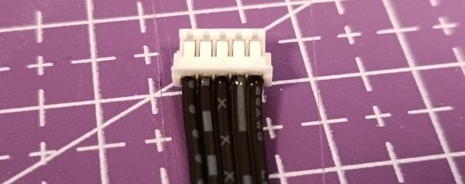 Close-up of the V4 connector with the epoxy glue holding the wires to the connector