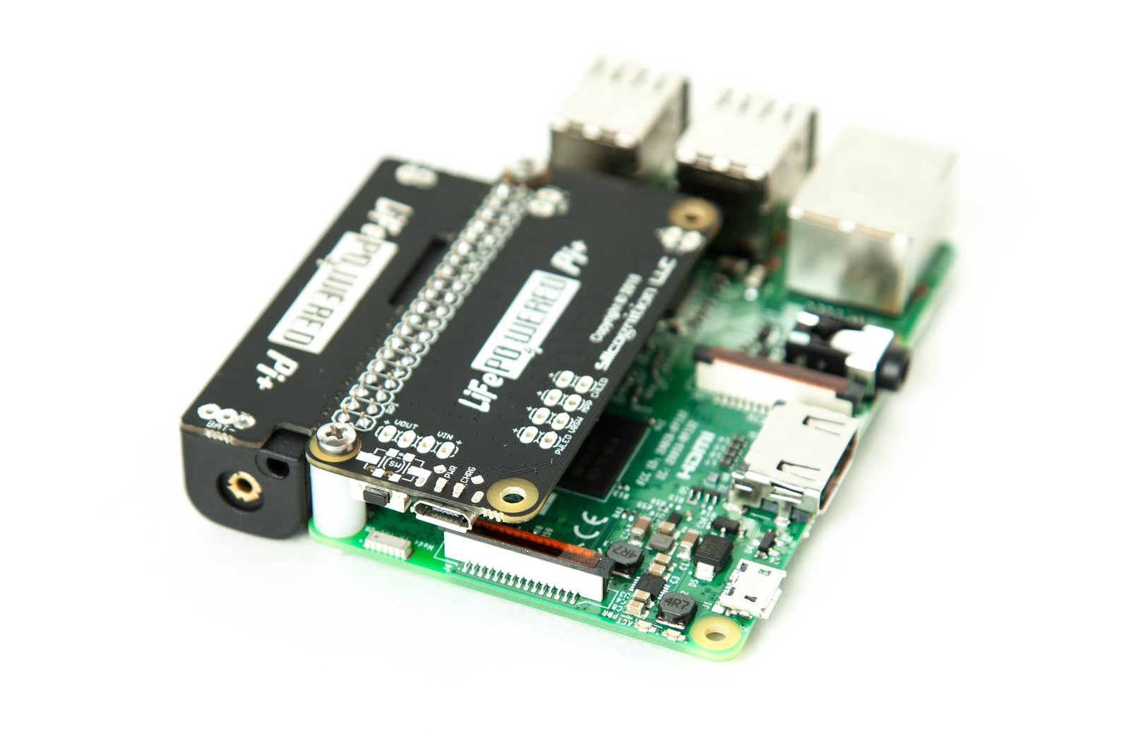 The mounting kit secures the LiFePO4wered/Pi+ to the Pi