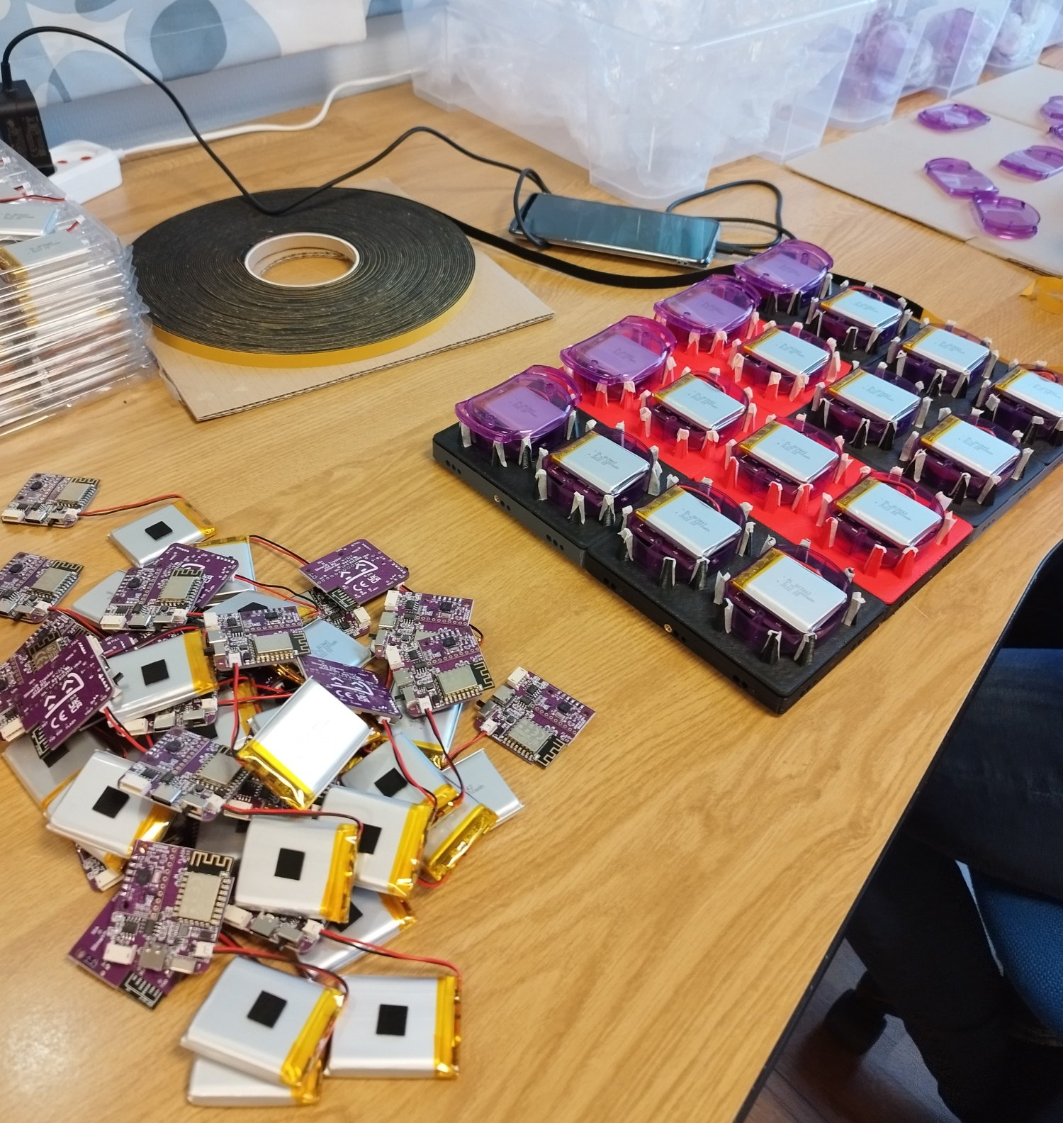 We connect batteries to the main boards and put them in a neat pile
