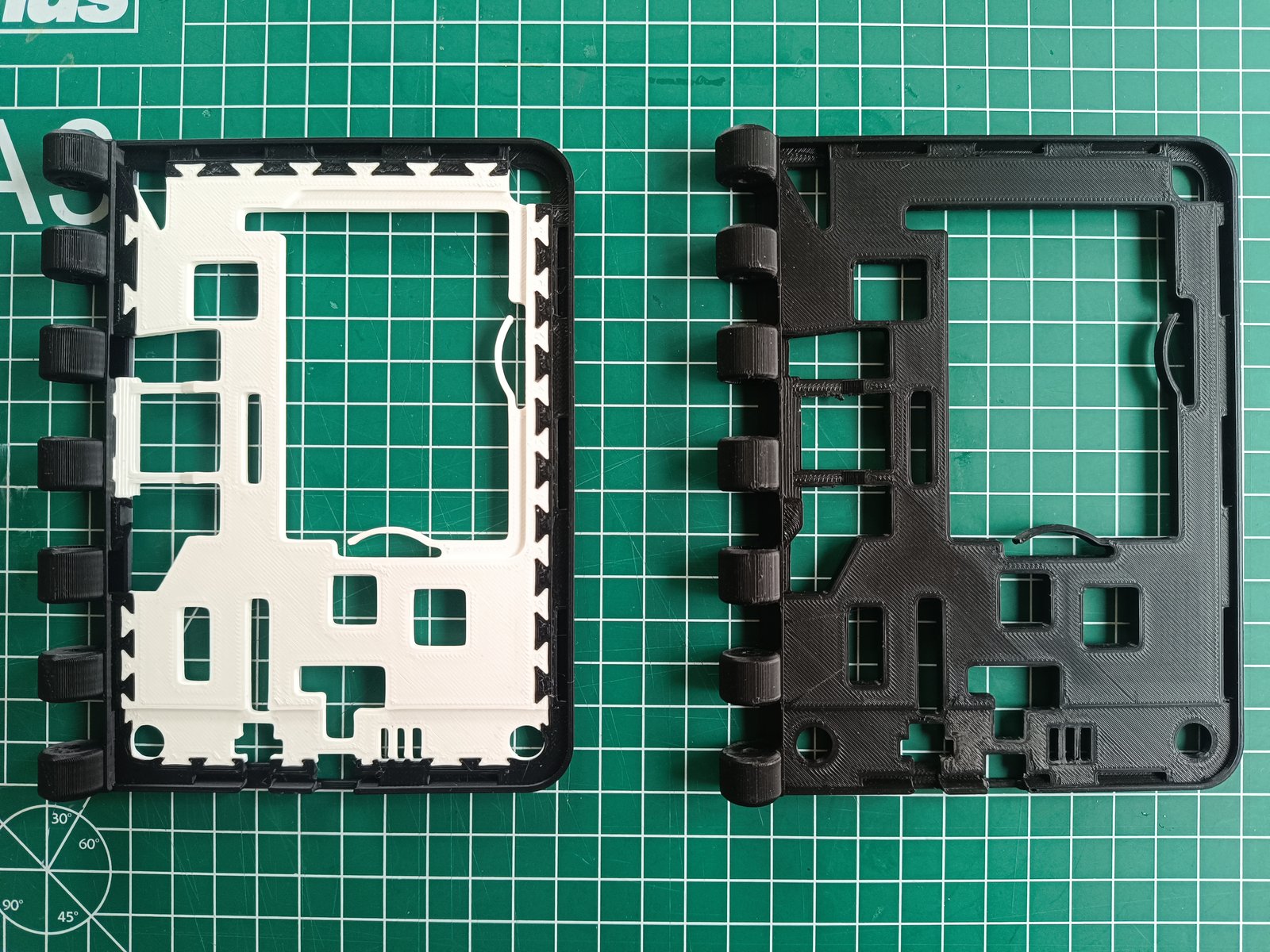 On the right: the old case component which was printed in one go by inserting dummy PCBs. On the left: the new case component which is printed as two parts and then assembled.