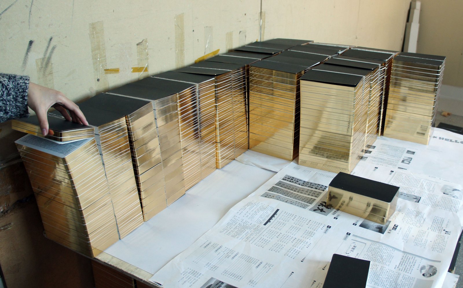 Stacks of books with gleaming, gilded edges