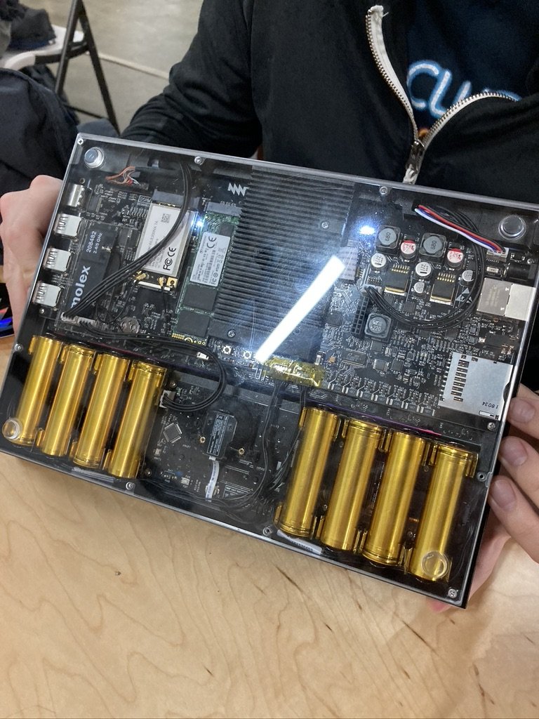 The bottom of an MNT Reform laptop showing gold-colored battery cells