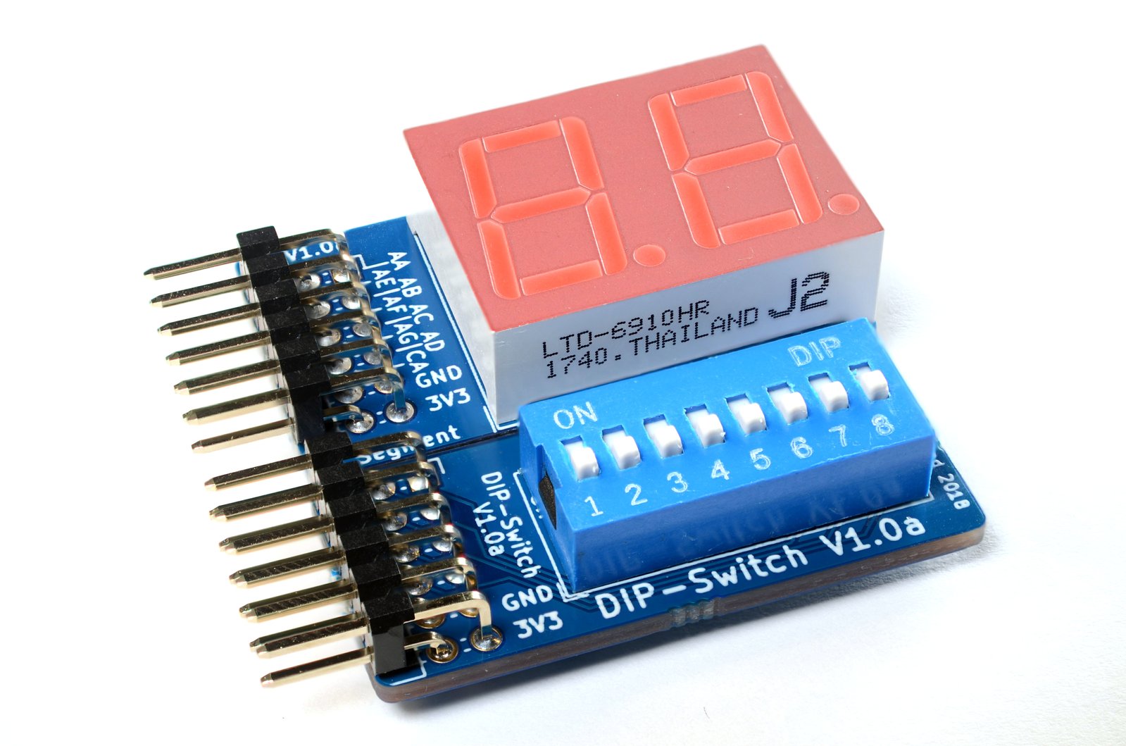 Side-by-side Pmods: seven-segment display (above) and DIP switch (below)