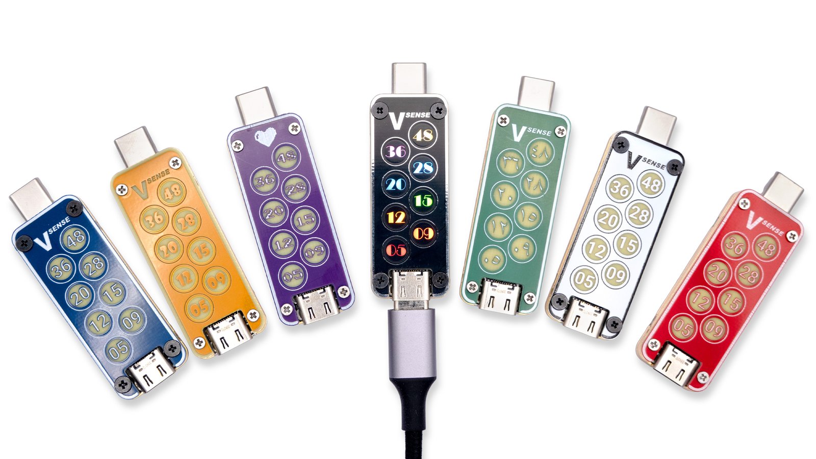 An image showing 7 units of USB VSense arranged together, each sporting a different faceplate color, material, or style. 
