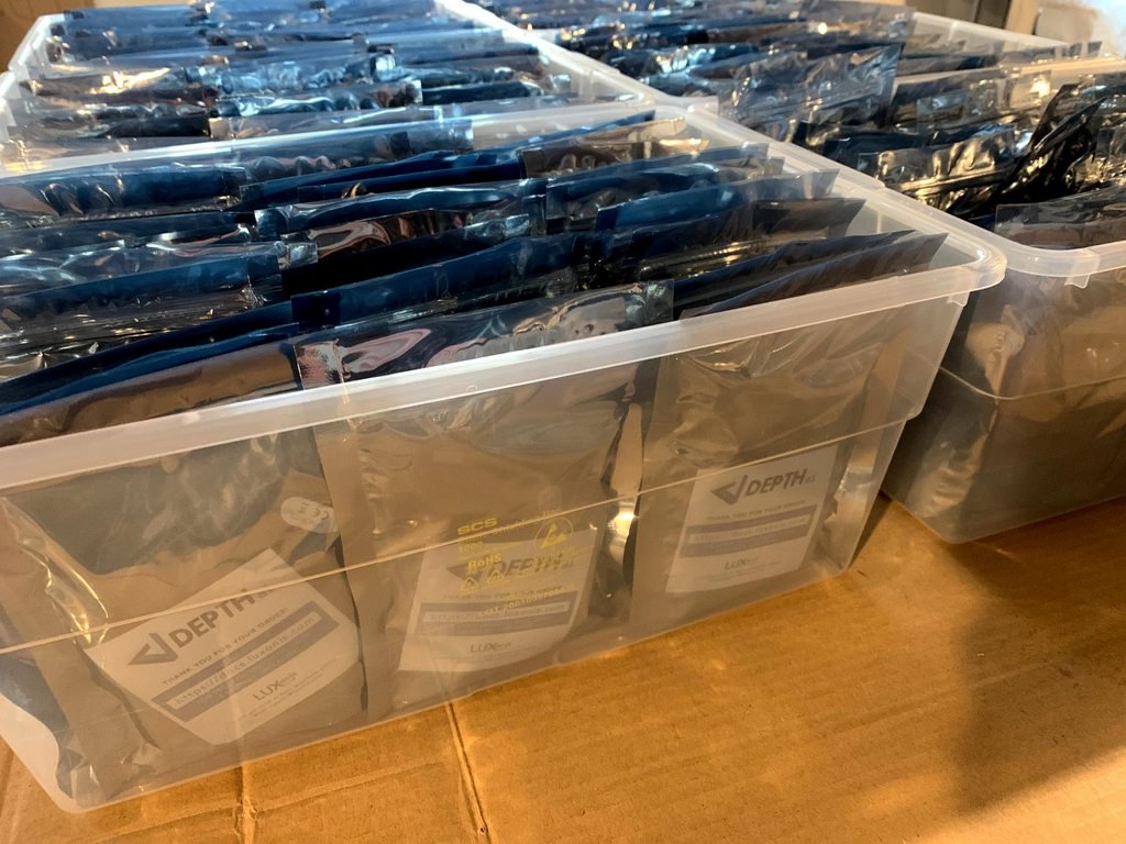 A bunch of megaAI, packed and sorted in a plastic bin.